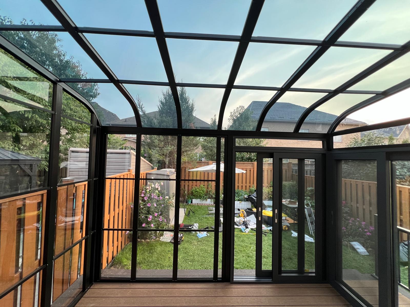 Interior view of a glass sunroom under construction
